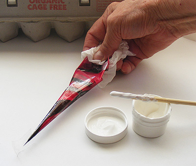 Clean and fold the tip of a 'white henna' cone