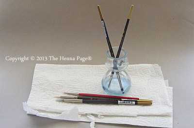 clean 'white henna' brushes