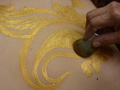 brush away excess powder from 'golden henna'