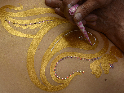 draw into your 'golden henna' with 'white henna' paste